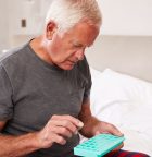 Senior Man taking pills